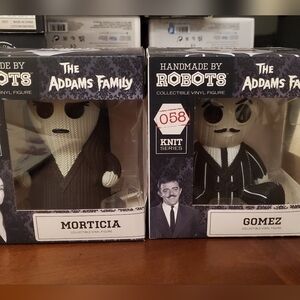 Morticia and Gomez figurines.